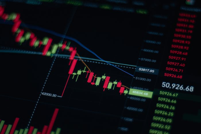 Close-up of stock market chart data on a digital monitor screen